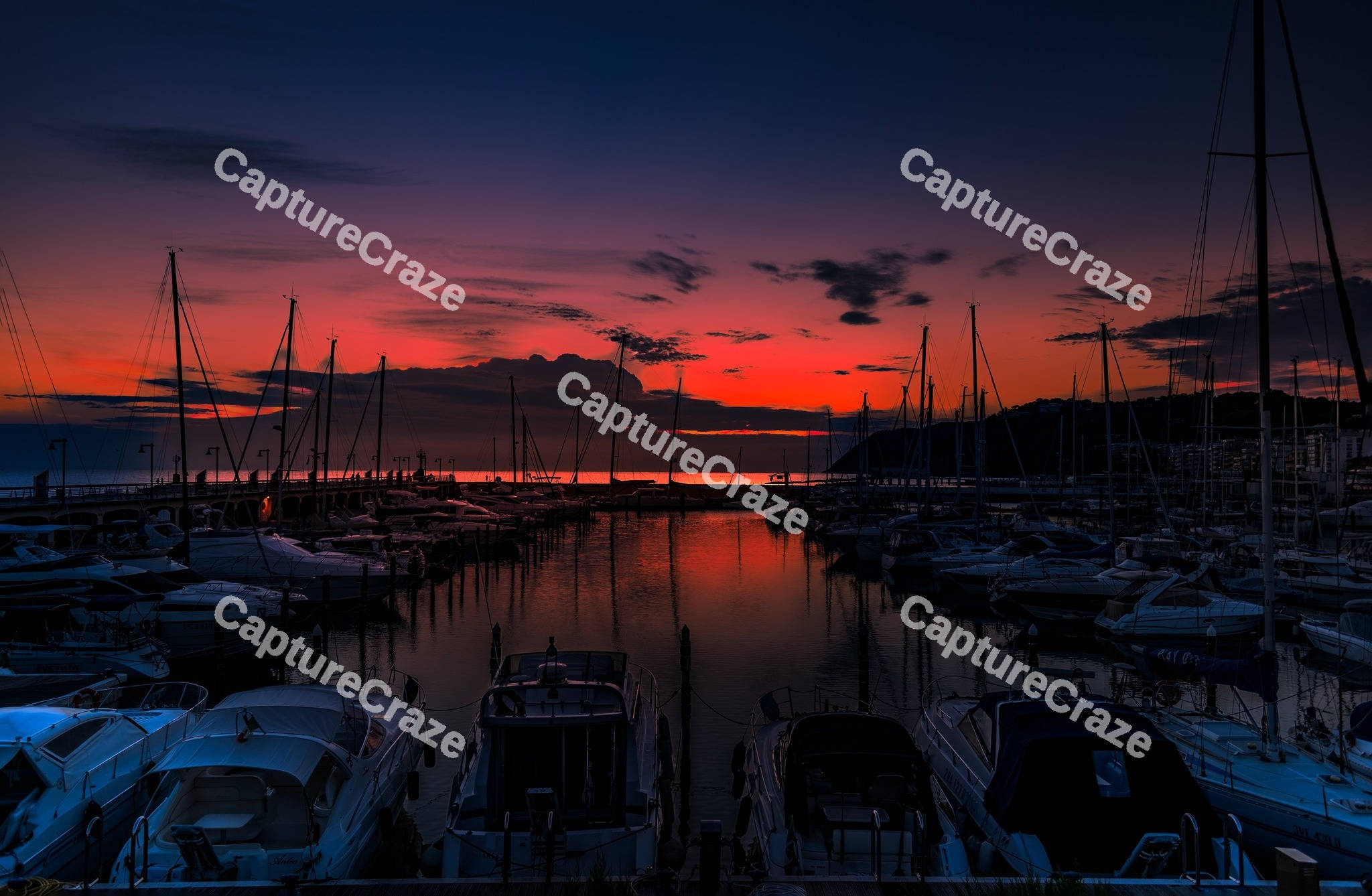 Yacht marina in the sea at sunset